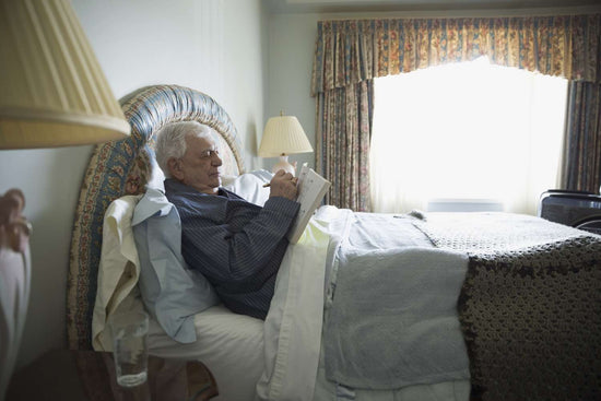 elderly man in bed with thirsty goose urinal