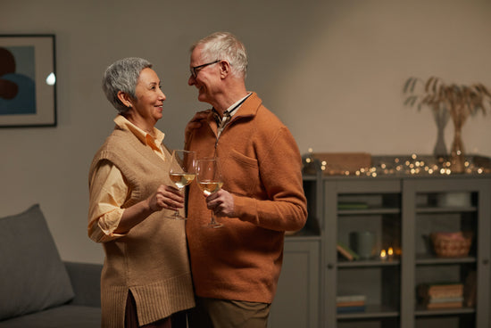Elderly couple at home looking comfortable and happy, likely because the man had a good sleep due to his portable urinal from Thirsty Goose. Thirsty Goose Urinal for the elderly or men with regular urination. Urinal, bedpan.